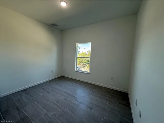 Empty room with baseboards