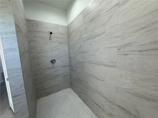 Bathroom with a tile shower