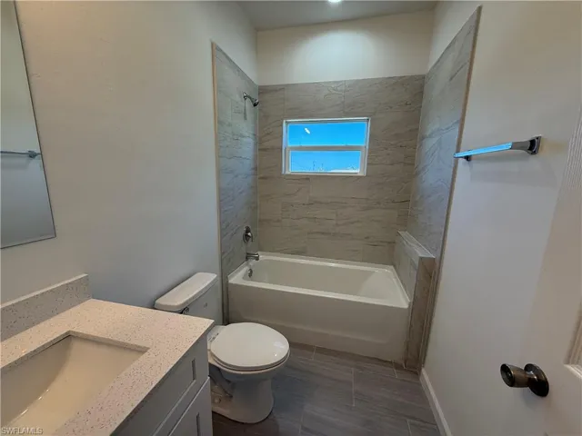 Full bath featuring vanity and shower / bathtub combination
