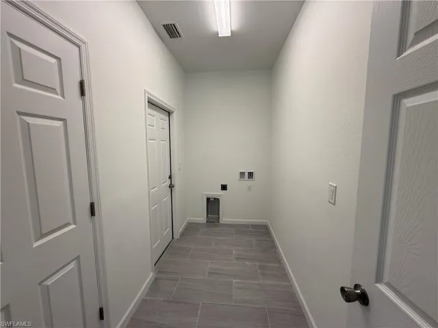 Laundry area featuring hookup for a washing machine and electric dryer hookup