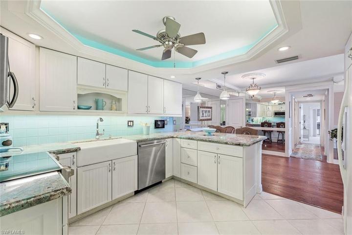 Beautiful custom coastal cabinetry, stainless steel appliances, and beautiful stone countertops.