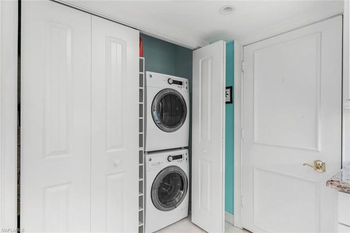 Stackable washer and dryer located conveniently in the kitchen.