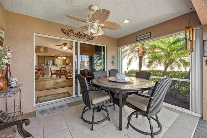 Covered lanai - screened opening to right has Accordion shutter