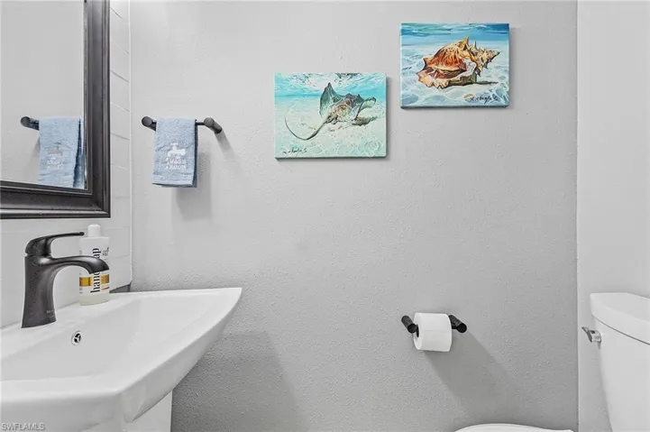1/2 Bathroom featuring sink and toilet