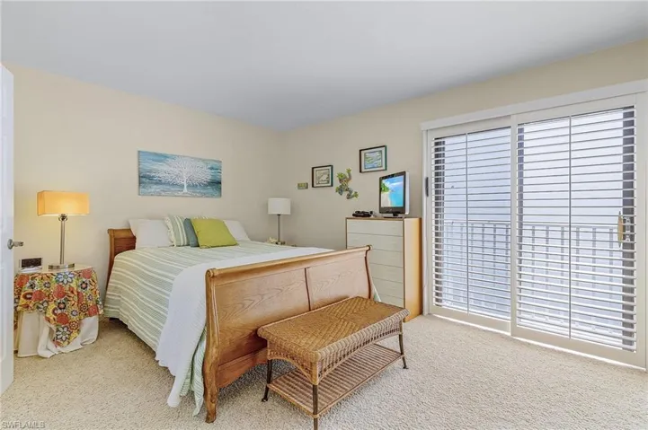 View of carpeted bedroom with its own bathroom , really 2 Master Suites