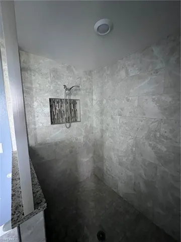 Bathroom featuring tiled shower