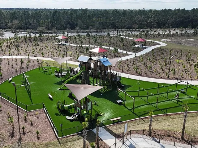 Palmetto Park featuring a 2 story treehouse themed playground