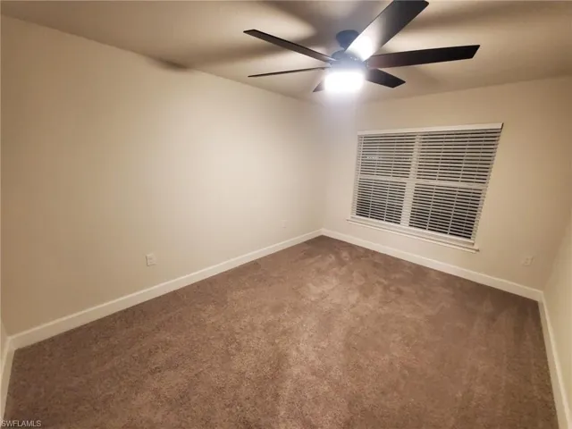 Unfurnished room with carpet flooring and ceiling fan