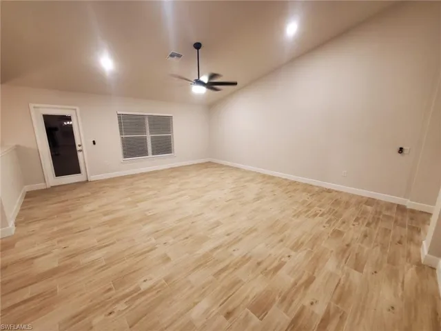Unfurnished room with light hardwood / wood-style flooring and ceiling fan