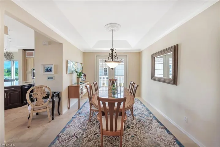 Formal dining with french doors to small patio
