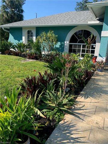 Front walkway,Mature gardens surrounding home