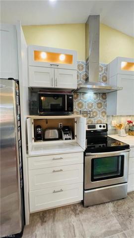 Lighted storage overhead in Kitchen