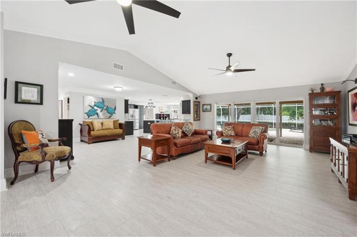 Living Room views to pool on lanai with pocket sliders