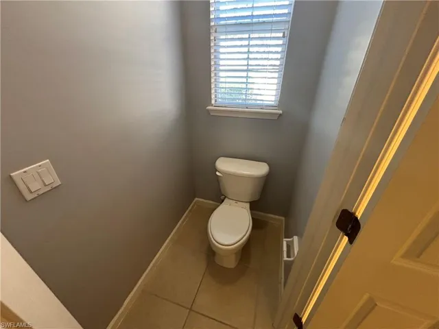 Bathroom featuring tile patterned flooring and baseboards