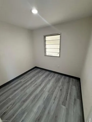 Spare room featuring light wood finished floors and recessed lighting
