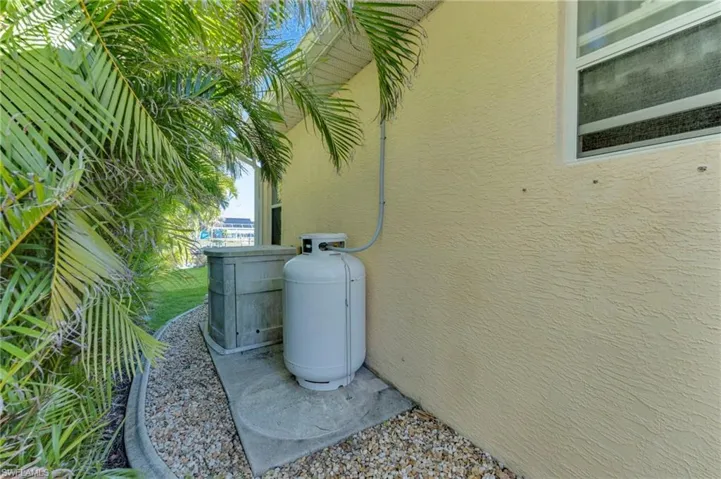Exterior details featuring stucco siding and heating fuel