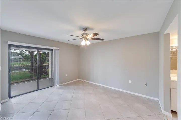Tiled empty room with ceiling fan