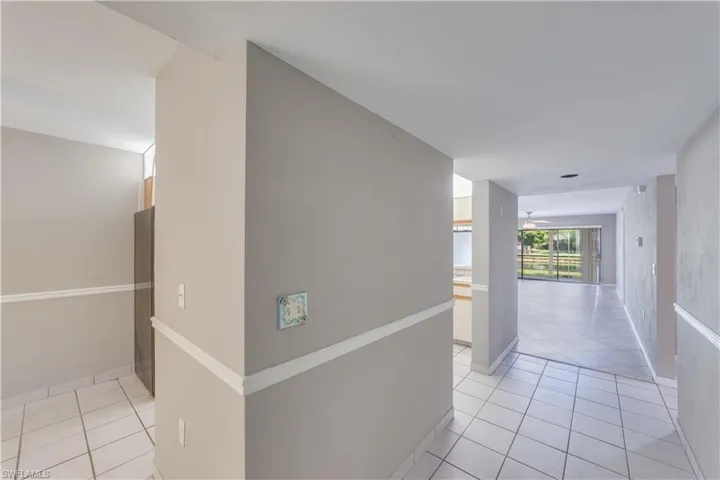 Hallway with light tile floors