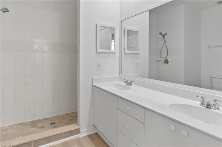 Master bath with duel sinks and large walk-in shower.