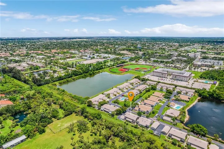 Aerial perspective of suburban area with a large body of water