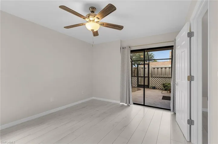 Unfurnished room featuring light wood-style flooring and a ceiling fan