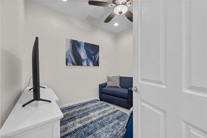 Sitting room with a ceiling fan, recessed lighting, baseboards, and visible vents