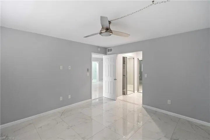 Empty room with baseboards and light marble finish flooring