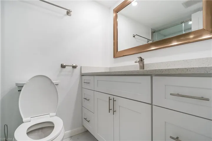 Bathroom with vanity and a shower