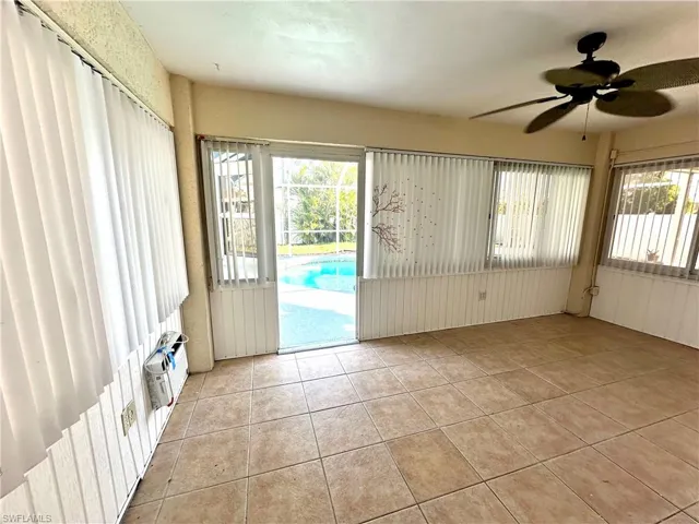 Unfurnished sunroom with a wealth of natural light