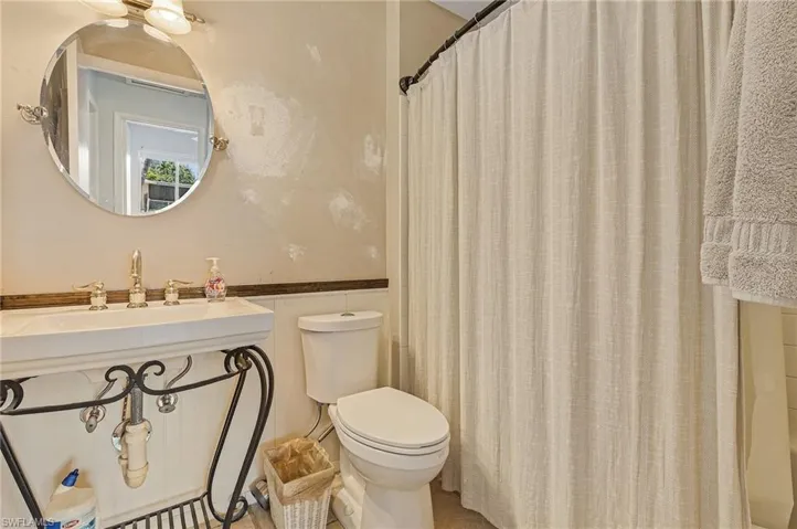 Bathroom with sink and toilet