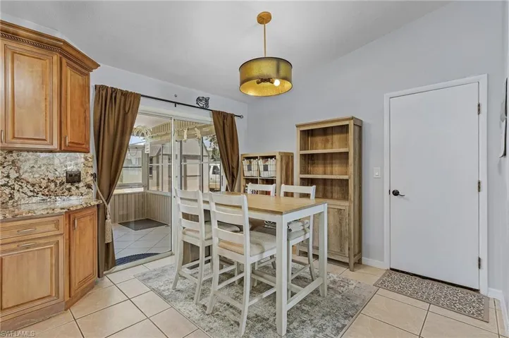 Dining space with light tile floors