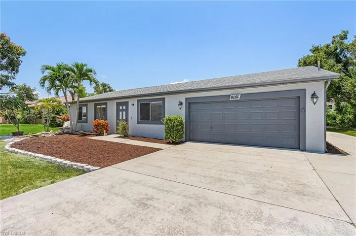Single story home with a garage
