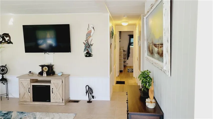 Living area with view of hallway.