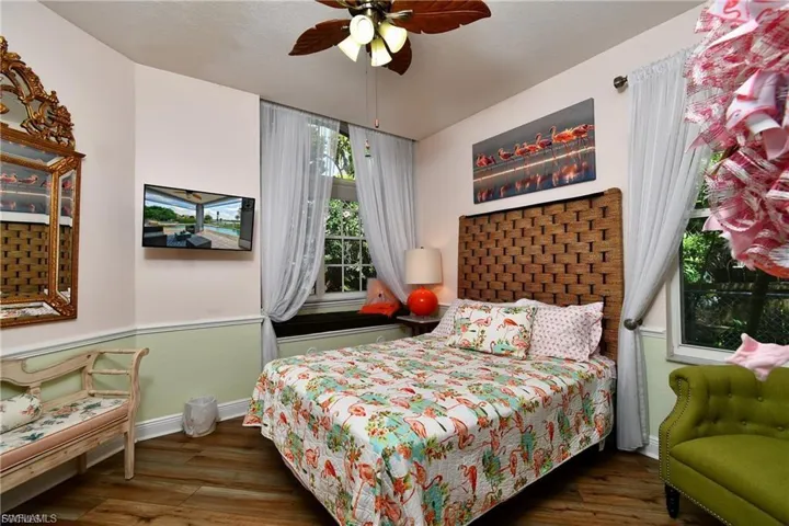 Bedroom featuring dark wood finished floors and ceiling fan