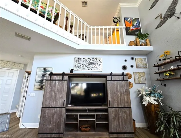 Detailed view of wood finished floors and crown molding