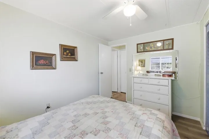 Bedroom #2 with a ceiling fan and dark wood-type flooring