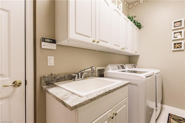 Laundry room with closet