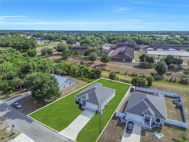 Single-story residence featuring a well-maintained front lawn and concrete driveway