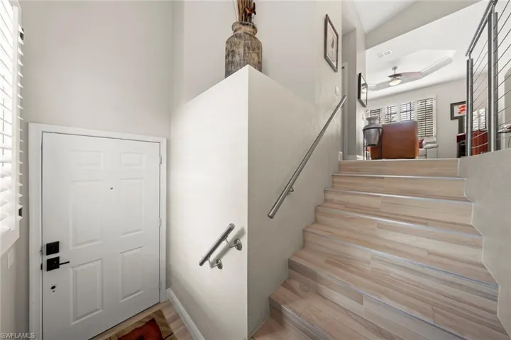 Wood look tile stairs with modern railing