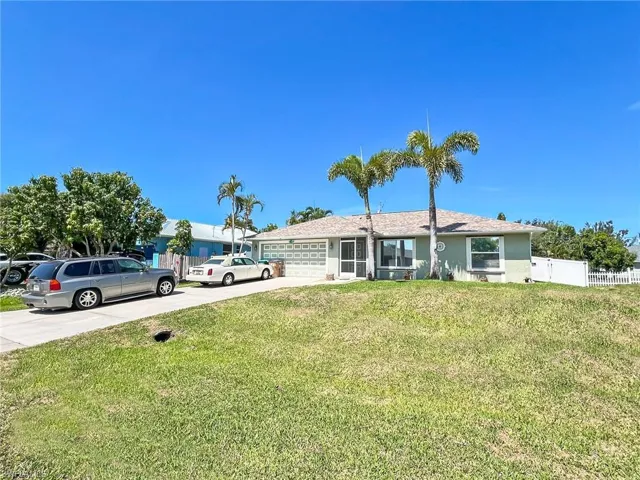 View of front of property with a front yard