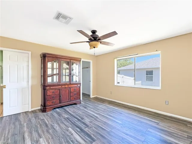 Entrance foyer featuring dark hardwood / wood-style floors and ceiling fan