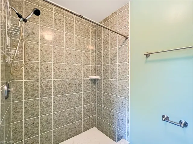 Bathroom featuring a tile shower