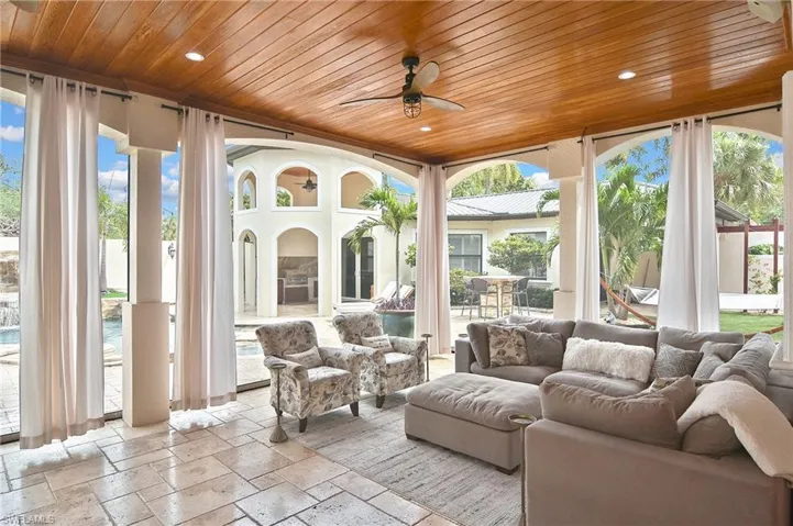 Main Level porch Screened or Screens up by a push of a button.