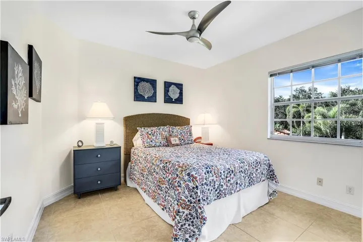 Tiled bedroom with ceiling fan