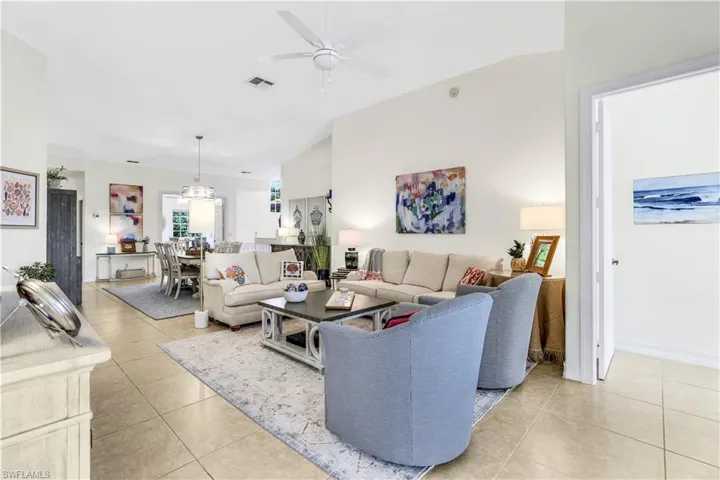 Tiled living room featuring ceiling fan