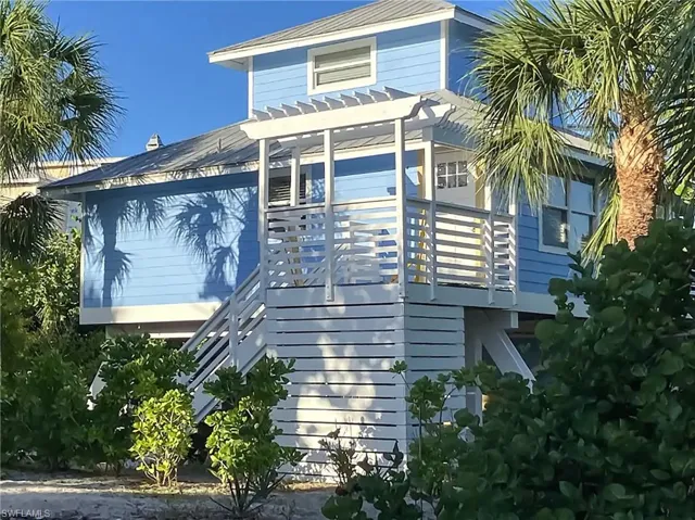 View of home's exterior featuring a pergola