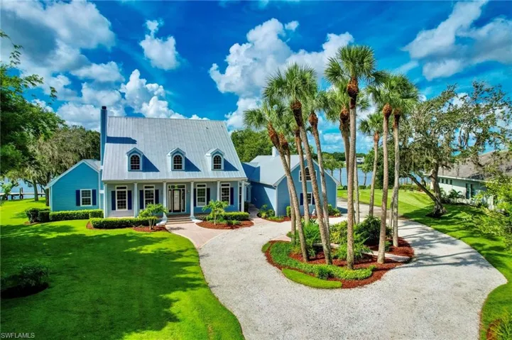 Front exterior-circular driveway, amazing landscaping