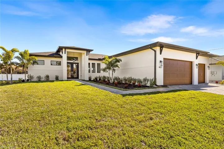 Features 3 car garage and professional landscaping
