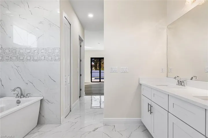 Spacious bathroom with dual sink vanity