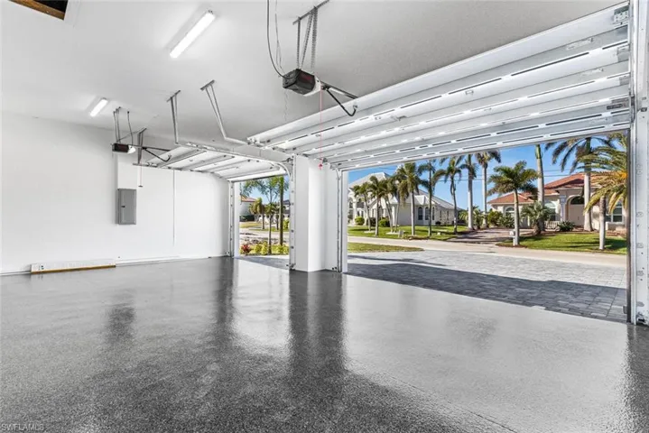 Spacious 3 car garage with epoxied floor